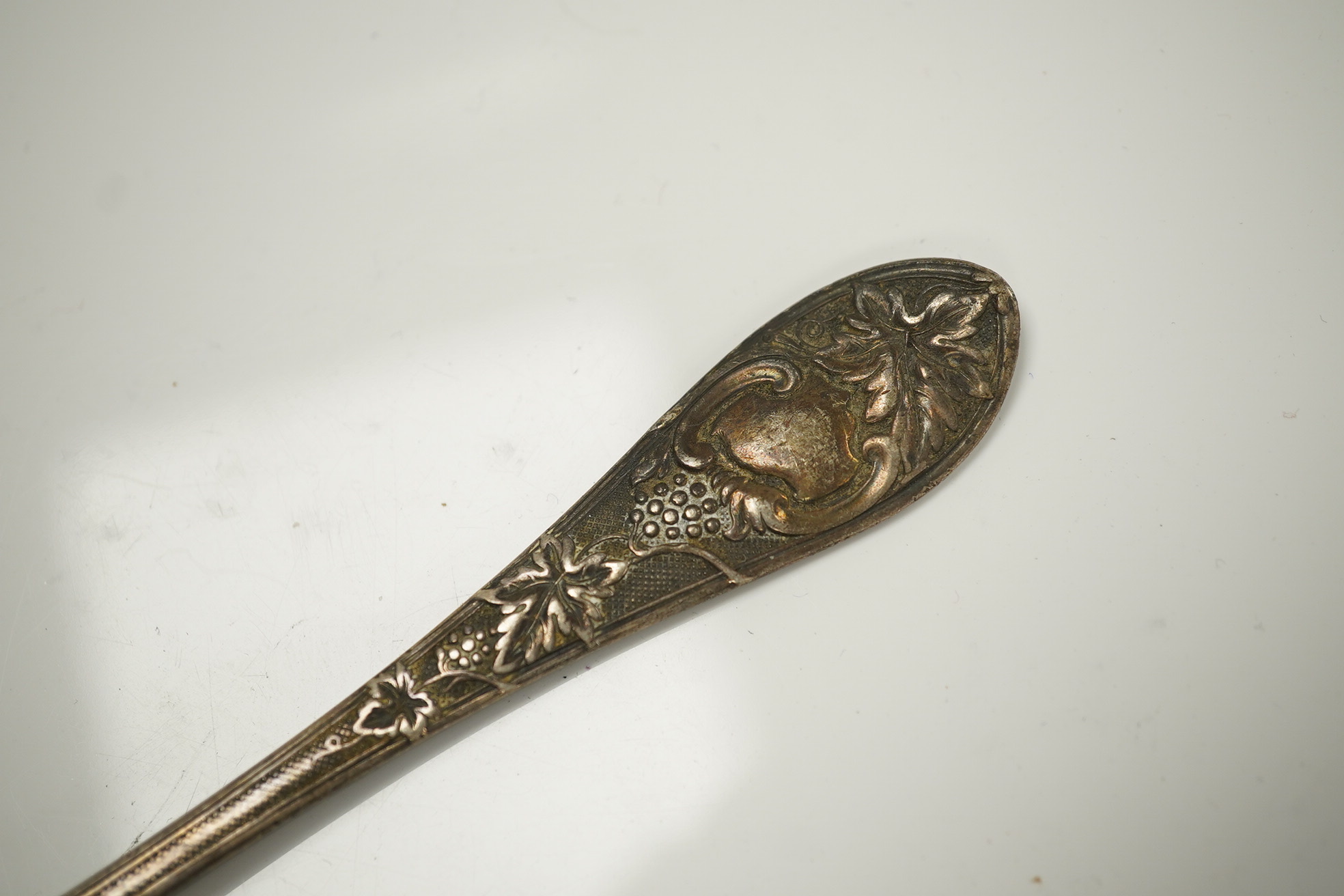 Twenty three items of mainly 19trh century silver fiddle pattern flatware, various dates and makers and a small group of assorted silver and white metal flatware, including Tiffany spoon, 39.8oz. Condition - poor to fair